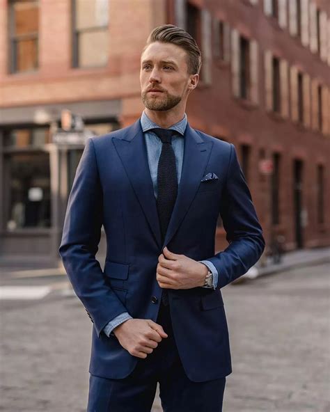 black shirt under blue suit.